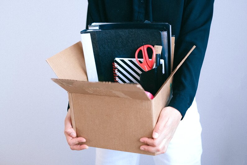 woman-carrying-box-made-redundant