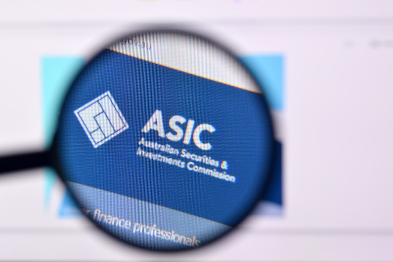 magnifying glass over asic sign