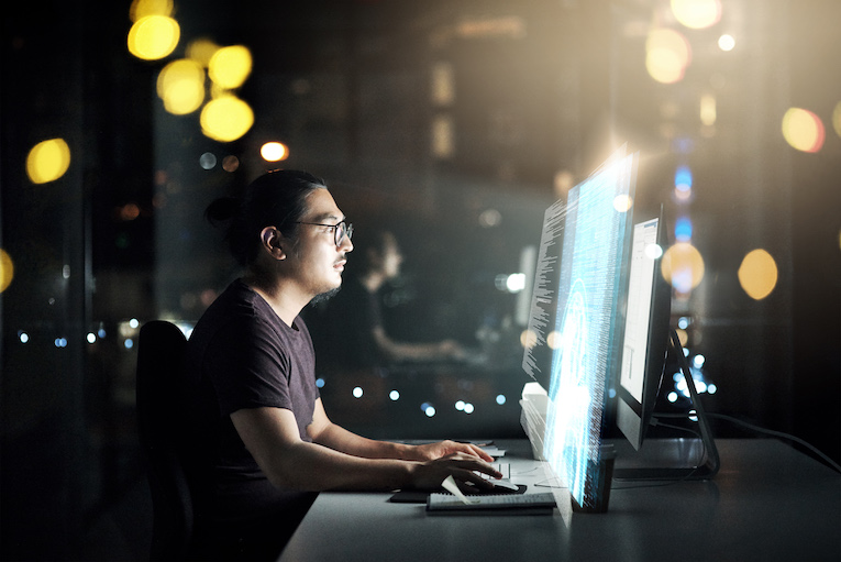 Cropped shot of a male computer programmer working late in the office on a new code