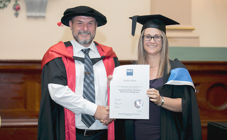 Kushla Wilson receiving her Graduation Certificate