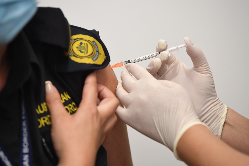 Australian Defence Force quarantine worker Corporal Boyd Chatillon receives the Covid-19 vaccine during a visit to Castle Hill Medical Centre.