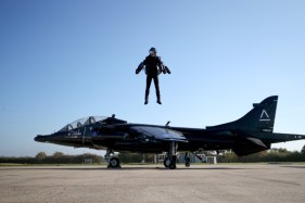 Watch a jet suit pilot fly onto a ship to trial the tech for fighting pirates