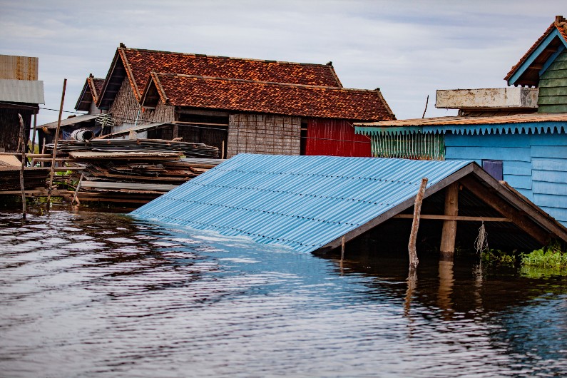 An Asian house flooded to its roof