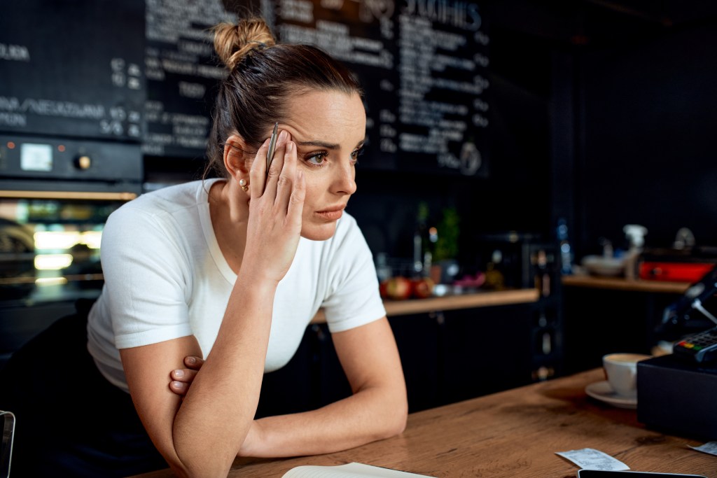 Frustrated small business owner in closed cafe