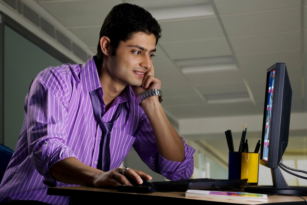 business man-smirking-desk-ASIO