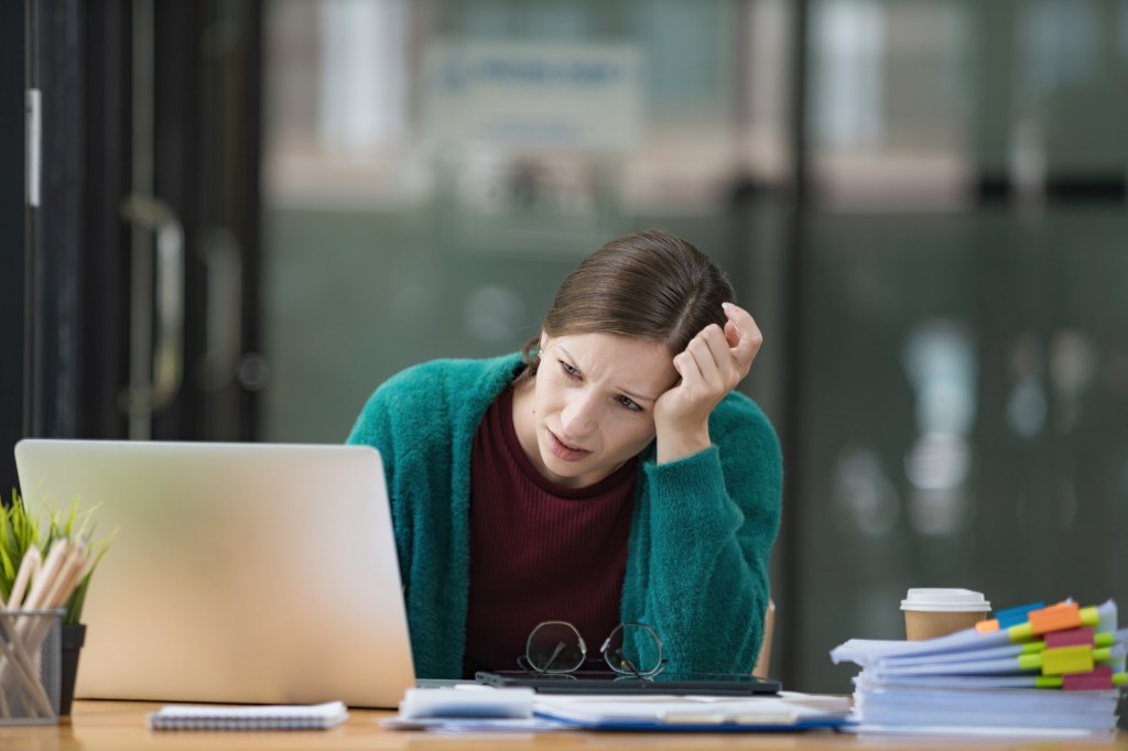 woman in front of laptop at desk